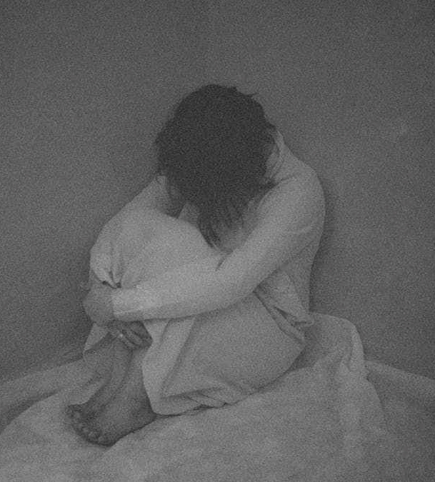 woman in white clothes on a corner